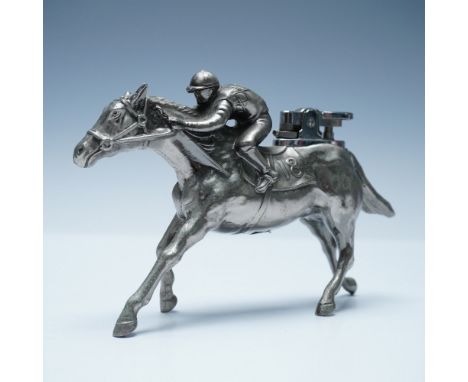A vintage metal figural lighter featuring a detailed depiction of a racehorse and jockey in full stride. The lighter mechanis