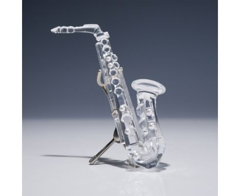 Part of the “Crystal Melodies” group, this retired Swarovski saxophone figurine was designed by Martin Zendron and introduced