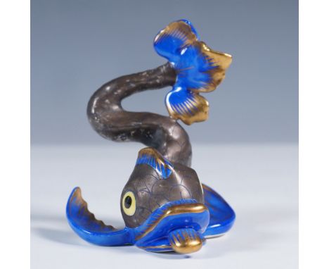 Charming hand painted piece featuring  a stylized fish in motion, rendered with a dynamic, curling body and expressive detail