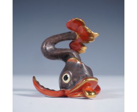 Charming hand painted piece featuring a stylized fish in motion, rendered with a dynamic, curling body and expressive detaili