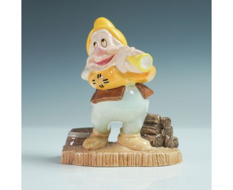 Royal Doulton Disney Showcase Collection figurine featuring Happy from the 1937 Disney film Snow White and the Seven Dwarfs. 