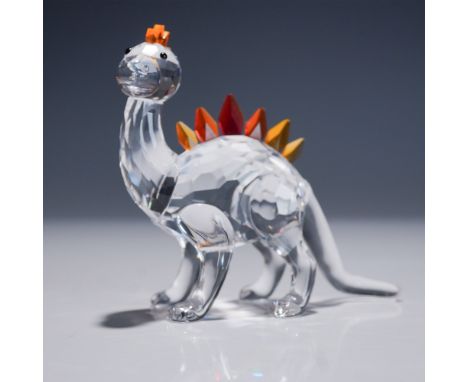Retired Swarovski crystal dinosaur figurine from the Fairy Tales collection. This charming piece features a clear crystal bod