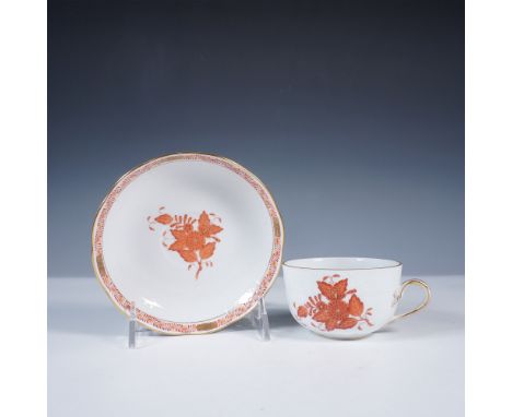 Hand painted porcelain teacup and saucer by Herend, Hungary, in the rust-red Chinese Bouquet pattern. The design features int