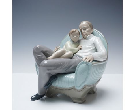 Heartwarming Nao by Lladro porcelain figurine titled In Grandpa's Arms (model 1346), portraying a tender moment of a grandfat