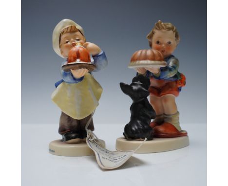 A pair of vintage M.I. Hummel figurines by Goebel, West Germany. The first figurine, titled Baker  (model 198/I), features a 