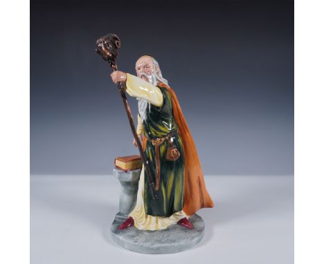 This figure is hand-made and hand-decorated in fine china. The figurine portrays the legendary wizard Merlin in a dynamic pos