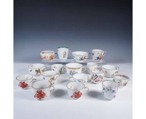 An exquisite collection of 17 Herend porcelain tea cups, each showcasing the renowned craftsmanship and artistry of the Hunga