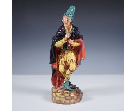 This hand-painted porcelain piece captures the folklore character mid-stride as he plays his pipe, dressed in vibrant medieva