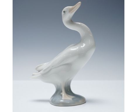 Playful and full of character, this Lladro porcelain figurine titled Little Duck (No. 1004552) features a charming duck with 