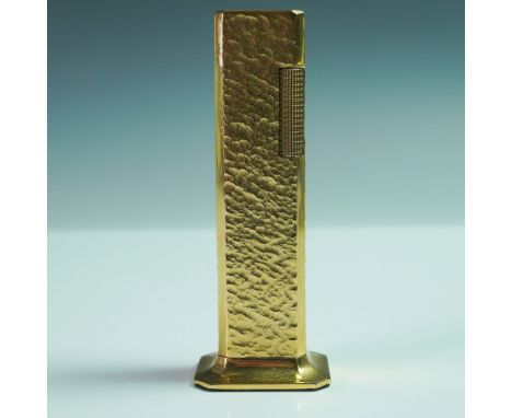 The lighter features a hammered-dimple texture across its rectangular body. The hinged lid opens to reveal the ignition mecha