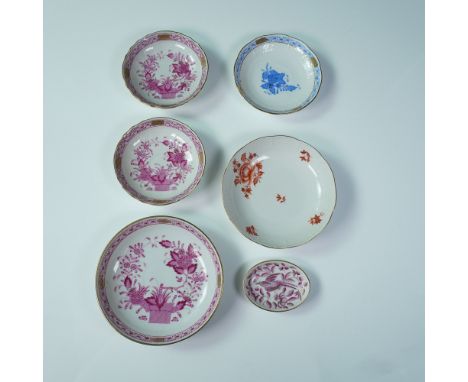 Collection of six hand-painted porcelain dishes by Herend, Hungary. Each piece features a unique floral motif in vibrant hues