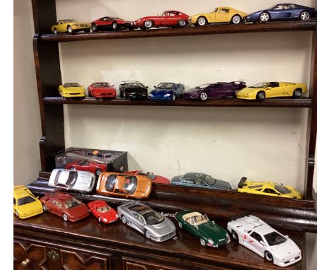 A good collection of 1:18 scale model cars. Est. £20 - £30.