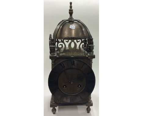 A brass mounted lantern clock. By Mappin & Webb. Est. £80 - £120.