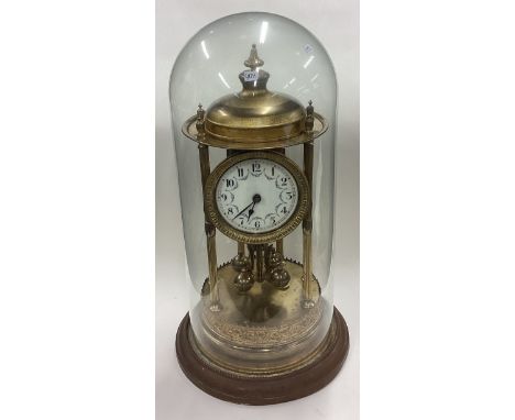 A large brass mounted mantle clock with white enamelled dial. Est. £60 - £80.