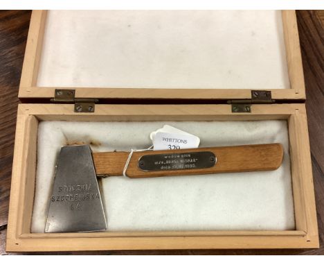 A cased launching axe for MS Hansa Wismar. Est. £20 - £30.