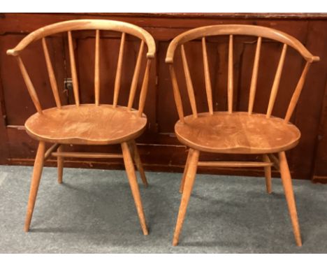 ERCOL: Two stick back chairs. Est. £40 - £60.