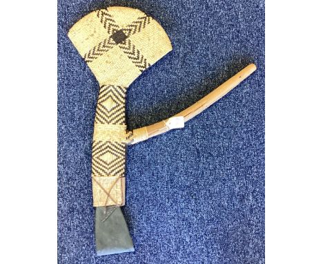An unusual Papua New Guinea axe. Est. £20 - £30.
