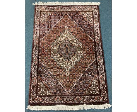 An old tapestry rug. Est. £20 - £30.