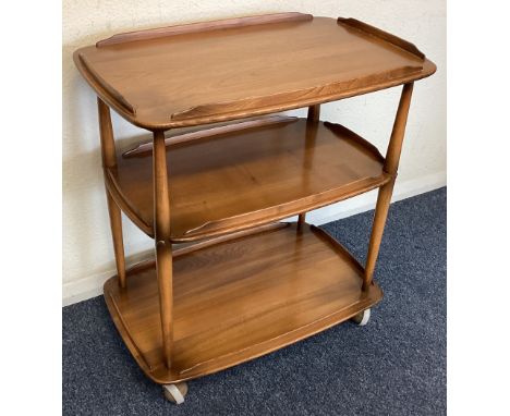 ERCOL: A small three-tier trolley. Est. £50 - £80.