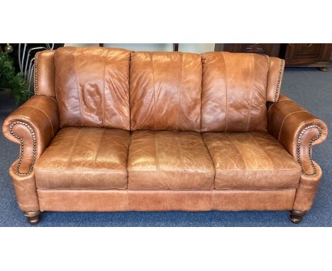 A good leather button back sofa. Est. £100 - £150.