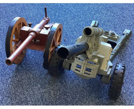 A large model of a Marx field gun together with one other. Est. £20 - £30.