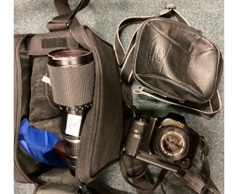 A bag containing camera lenses etc. Est. £20 - £30.