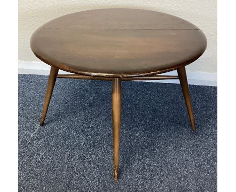 ERCOL: A small drop flap table. Est. £30 - £40.