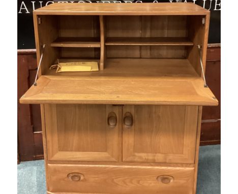 ERCOL: A good drop flap cupboard with single drawer. Est. £50 - £80.
