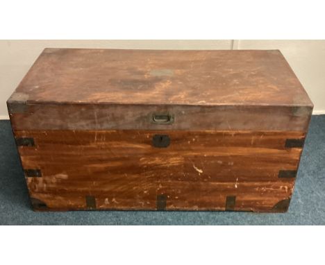 An Antique brass bound camphorwood trunk. Est. £150 - £200.