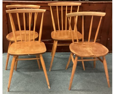 ERCOL: A set of four matched stick back chairs. Est. £50 - £80.