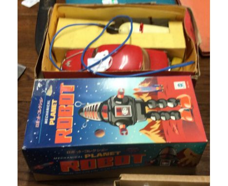 An unusual child's electric model of a Vauxhall together with a toy robot. Est. £20 - £30.