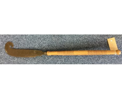 A large and unusual axe. Est. £20 - £30.