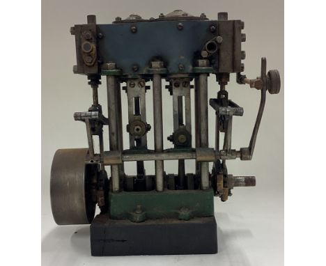 A small model engine. Est. £30 - £40.