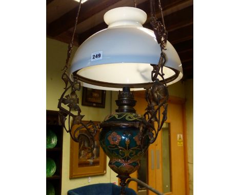 A LATE VICTORIAN HANGING CHANDELIER WITH CERAMIC AND GLASS OIL RESERVOIR.
