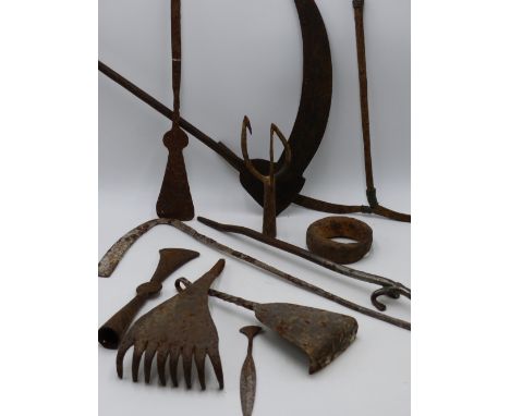 AN AFRICAN IRON CURRENCY SICKLE WITH GEOMETRIC ENGRAVED DECORATION TOGETHER WITH VARIOUS FURTHER IRON CURRENCY TOOLS AND ARTI