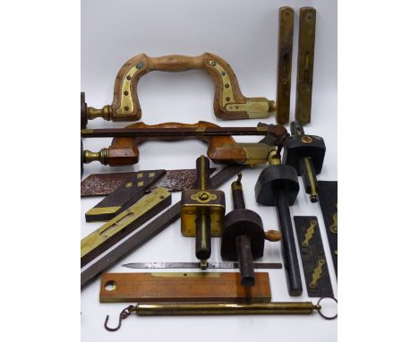 TWO ANTIQUE BOXWOOD AND BRASS MOUNTED DRILL BRACE, VARIOUS BRASS MOUNTED SPIRIT LEVELS, THREE HARDWOOD AND BRASS MARKING GAUG