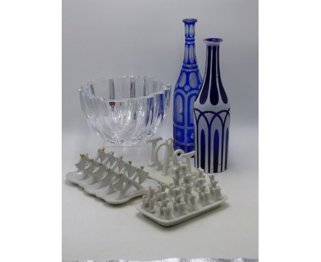 A CUT GLASS ORREFORS DEEP BOWL, THREE VINTAGE POTTERY TOAST RACKS AND TWO BOHEMIAN DECANTERS.