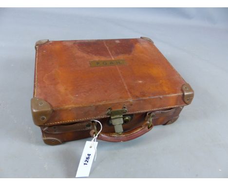 AN EARLY 20TH. CENTURY LEATHER SHOT GUN CARTRIDGE MAGAZINE WITH ARMY AND NAVY TRADE LABEL. (WIDTH 40 CMS.). 
