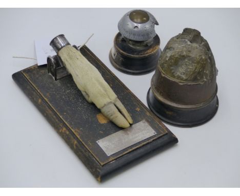 TWO WWI BATTLERFIELD RELICS, A GERMAN SHELL FUSE TIMER WITH LABEL THE CALVERT MENIN ROAD YPRES JUNE 18TH 1916 AND A HEAVY ART