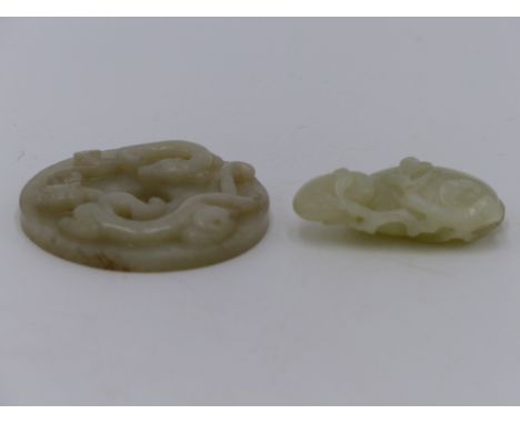 TWO PIECES OF CHINESE CARVED JADE, A PEACH AND AN ARCHAIC DESIGN PENDANT.