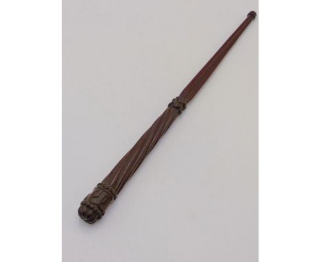 A 19TH CENTURY CARVED MAHOGANY BATON OF SHORT STAFF WITH REEDED DECORATION AND CARVED MONOGRAM,  E.M.S.  42.5CMS.
