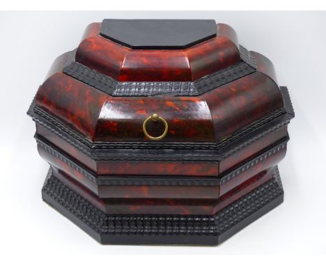 A RED TORTOISE SHELL CADDY WITH EBONY BOLLECTION AND RIPPLE MOULDINGS. (APPROX WIDTH 29 CMS).