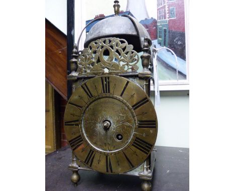 AN ANTIQUE LANTERN CLOCK SIGNED FRAN STAMPER, LONDON, NOW FITTED WITH BRASS SINGLE FUSEE MOVEMENT STRIKING A BELL.