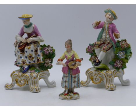 A PAIR OF CHELSEA STYLE PORCELAIN FIGURES, A BOY PLAYING CYMBALS AND A GIRL PLAYING A LUTE, POLYCHROME DECORATION WITH GILT A