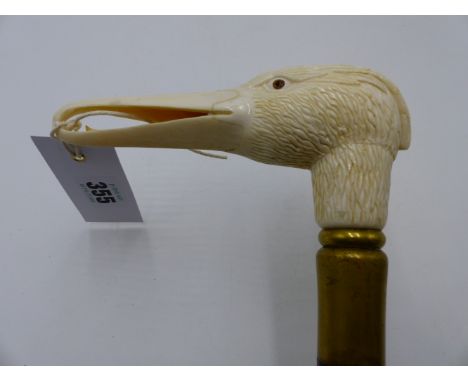 AN IMPRESSIVE LATE 19TH OR EARLY 20TH CENTURY IVORY WALKING STICK HANDLE FINELY CARVED IN THE FORM OF A LONG BILLED BIRD AND 