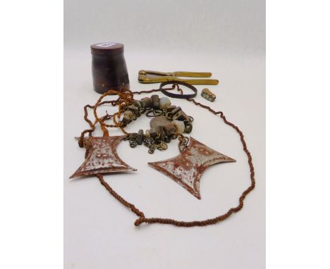 AN UNUSUAL TRIBAL BEAD NECKLACE STRUNG WITH SQUARE FORM BEADS, TWO JADE BEADS AND SILVER COIN. TOGETHER WITH A BETEL NUT CUTT