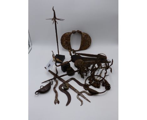 A COLLECTION OF WEST AFRICAN IRON CURRENCY TO INCLUDE A GONG, TOOLS,  SNAKES AND OTHER ANIMALIA, TWO IRON BRACELETS, ETC.  YO