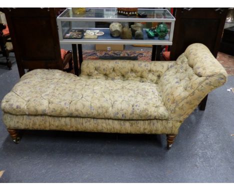 A VICTORIAN BUTTON UPHOLSTERED CHAISE LONGUE.