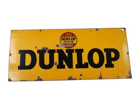 A Dunlop Single-Sided Advertising Sign, with black lettering on a yellow ground Dunlop Stock Dunlop, one corner stamped REFMS