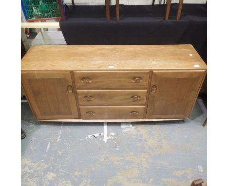 Ercol low sideboard with three central drawers to two cupboards, staining to top, 157 x 42 x 69 cm H. Not available for in-ho